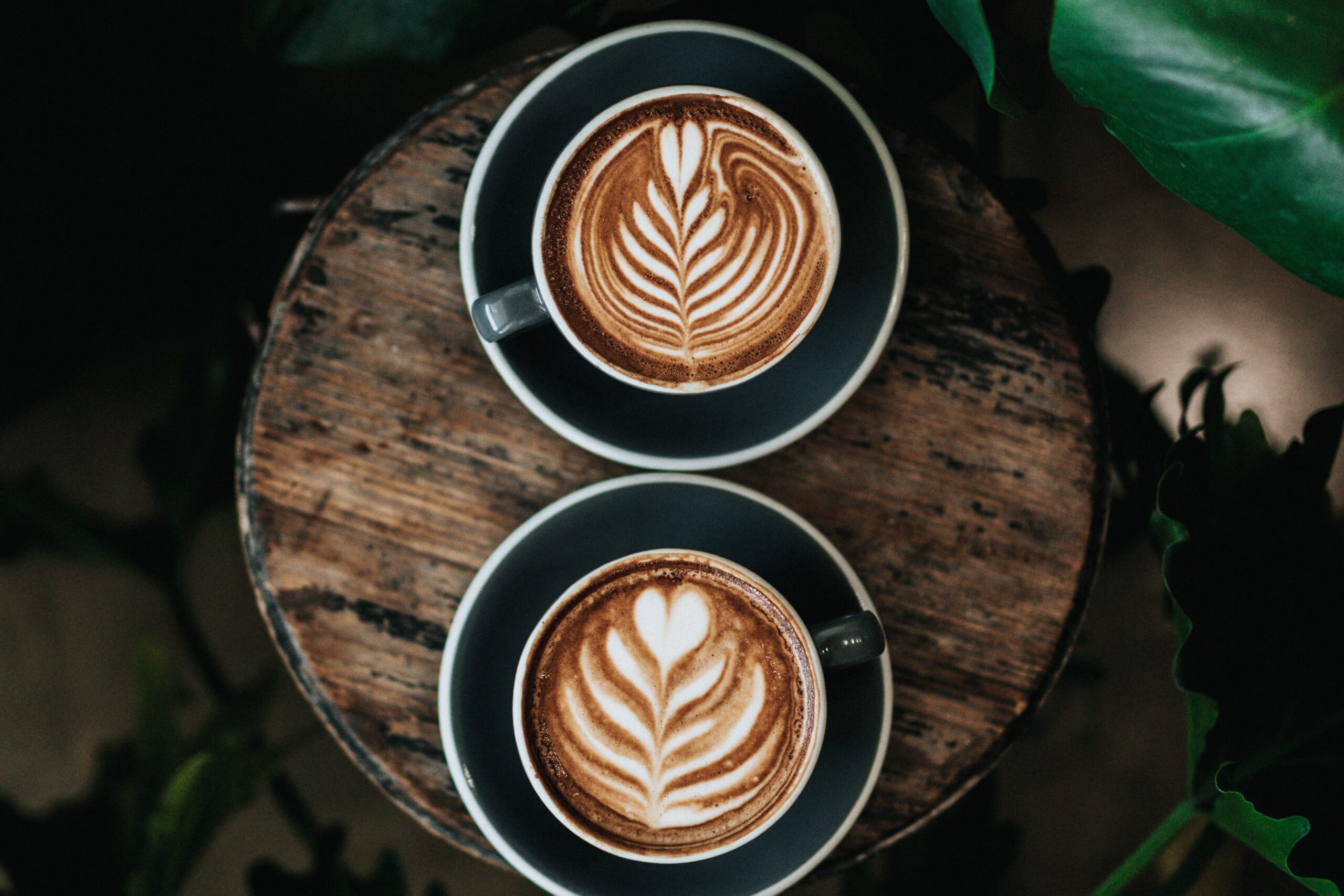 Two people collaborating over coffee